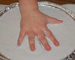 hand being cast in plaster