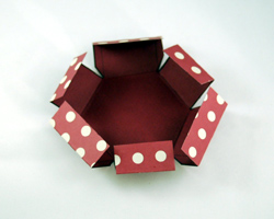 folding the tabs on the lid
