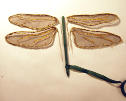 wrapping wires around body to secure wings