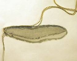 applying gold bead trim