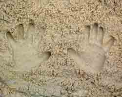 handprints in the sand