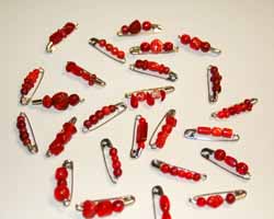 red beaded safety pins