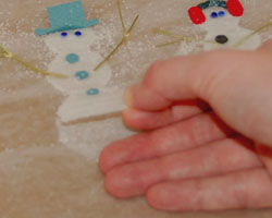 peeling snowman off the wax paper