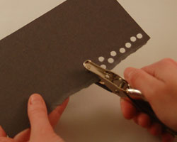 punching out holes using a hole puncher