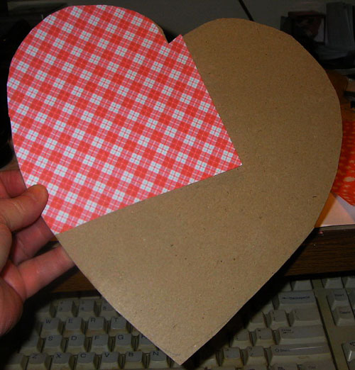 covering heart in paper