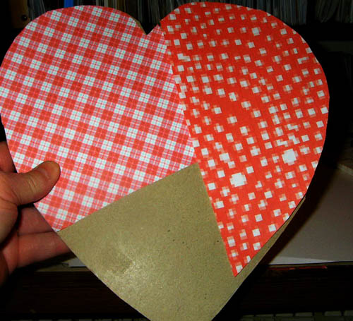 covering heart in paper